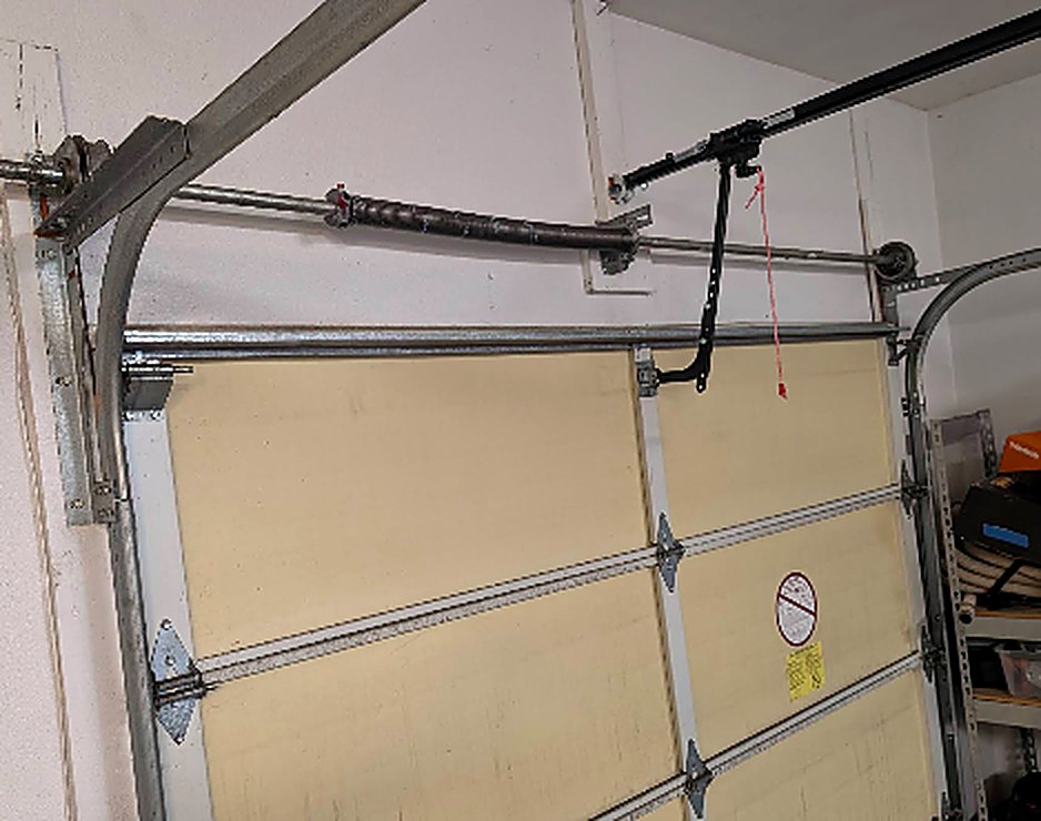 Garage door torsion spring and opener arm repair